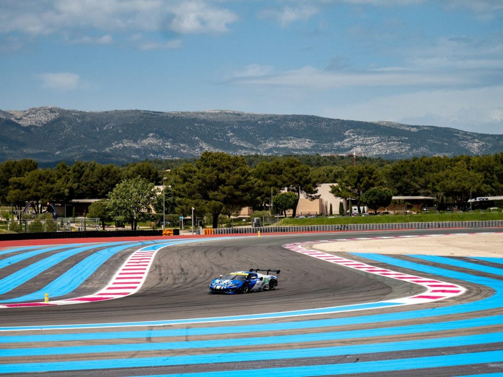 A race car speeds around a track.