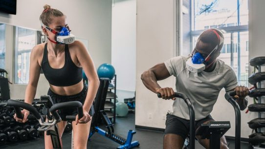 a man and a woman in a gym