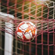 Soccer ball stuck in the goal net