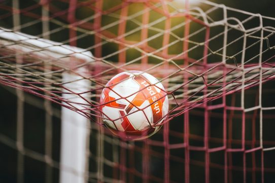 Soccer ball stuck in the goal net