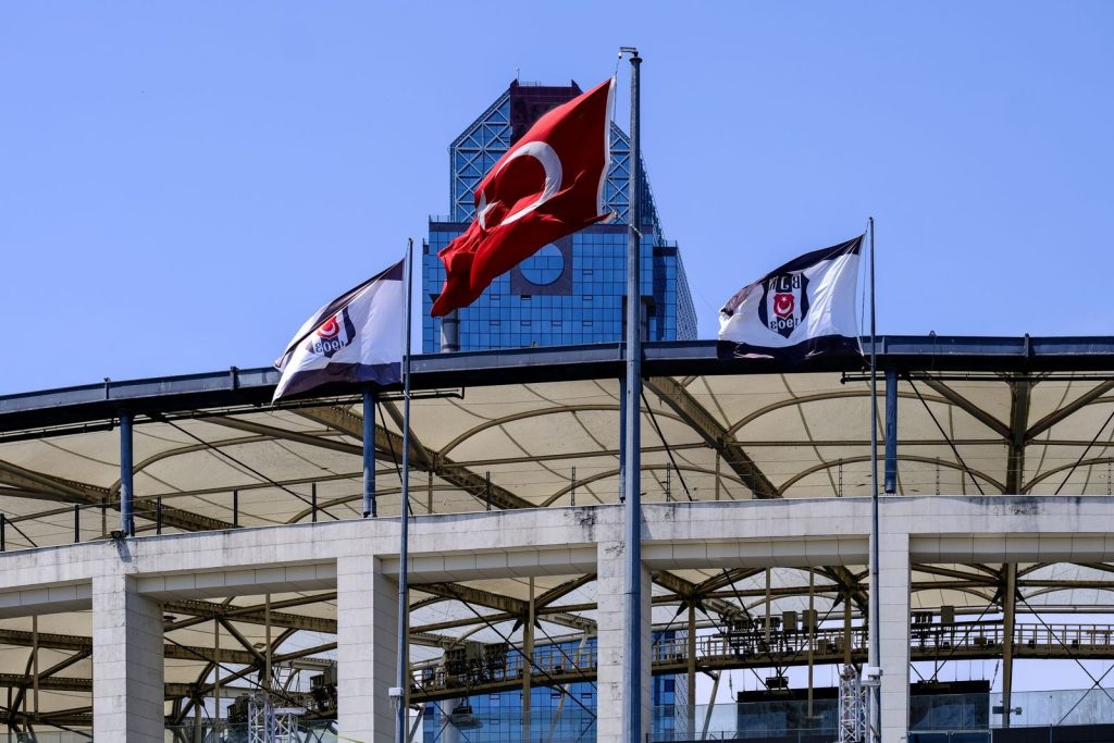 View of Beşiktaş Stadium in İstanbul with Turkish national flags waving in the wind.