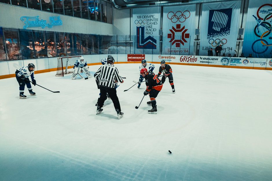Action-packed ice hockey game at an indoor rink in Buenos Aires, showcasing players in intense competition.